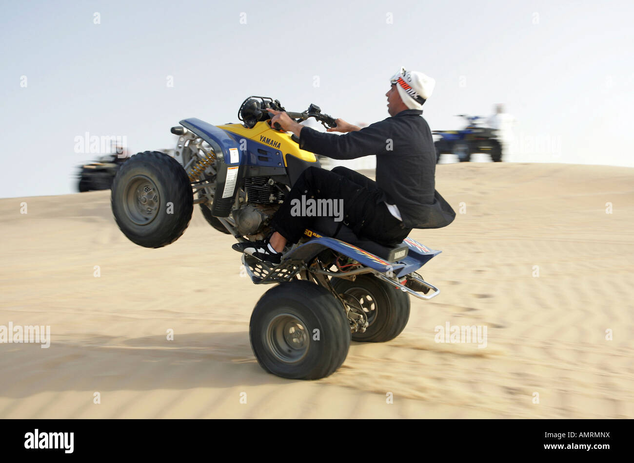 Quad-Fahrer in der Wüste Stockfoto