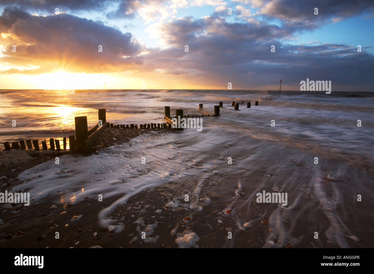 Hunstanton Buhnen fotografiert bei Sonnenuntergang auf der nördlichen Küste von Norfolk, UK. Stockfoto