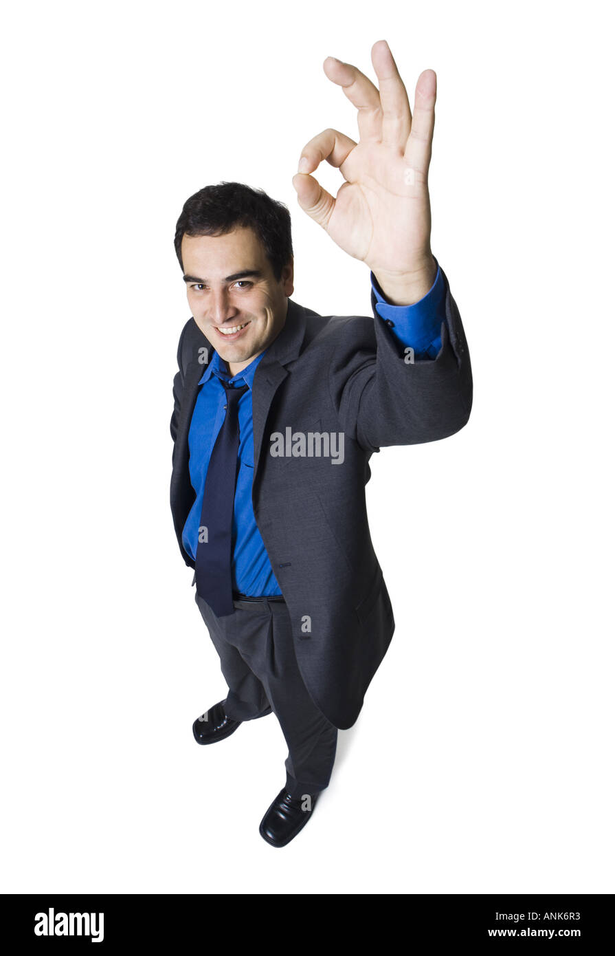 Erhöhte Ansicht eines Kaufmanns machen an OK Sign. Stockfoto