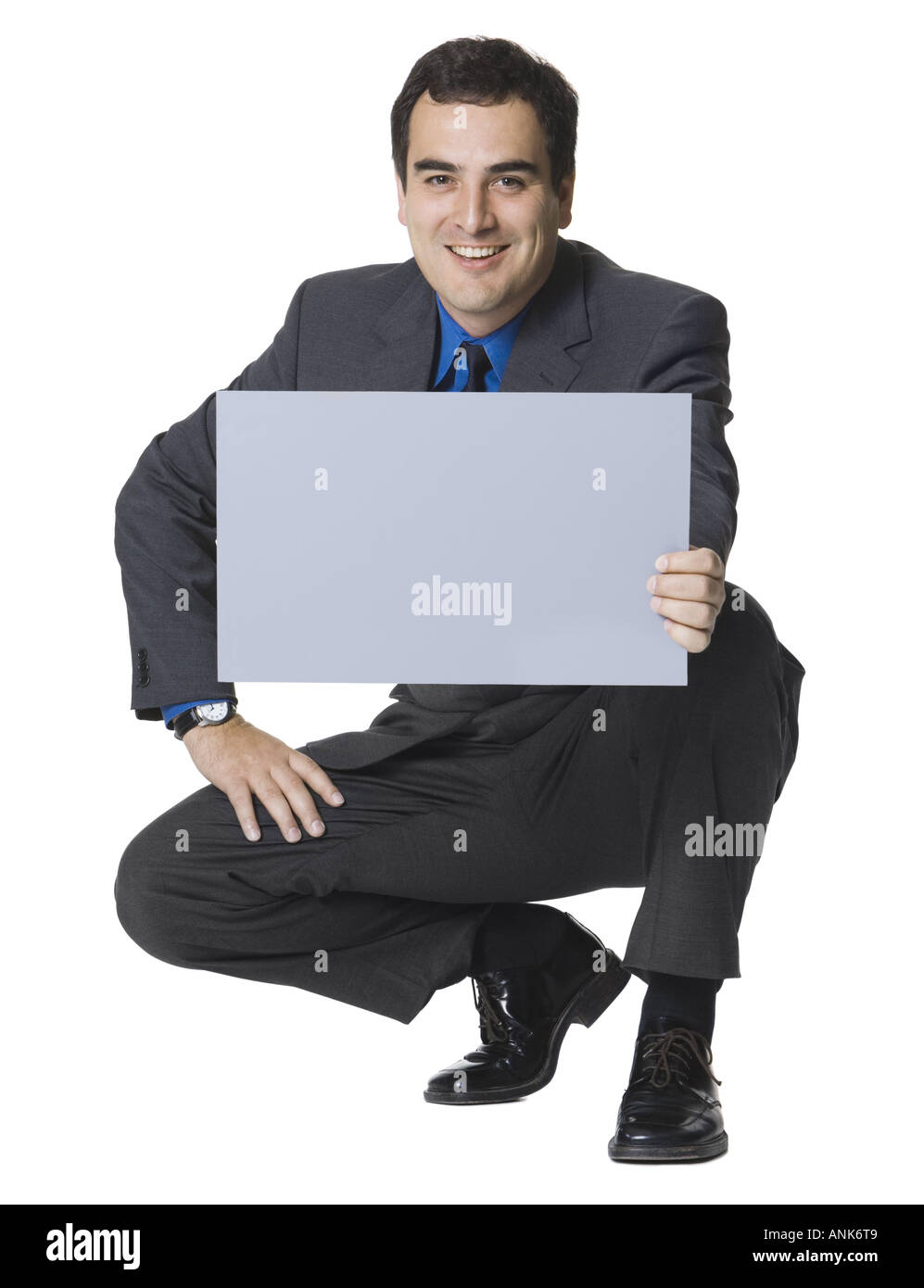 Geschäftsmann mit einem leeren Schild Stockfoto