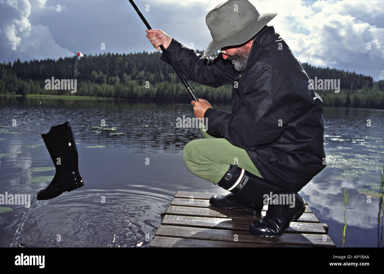 Angler fängt eine boot Stockfoto