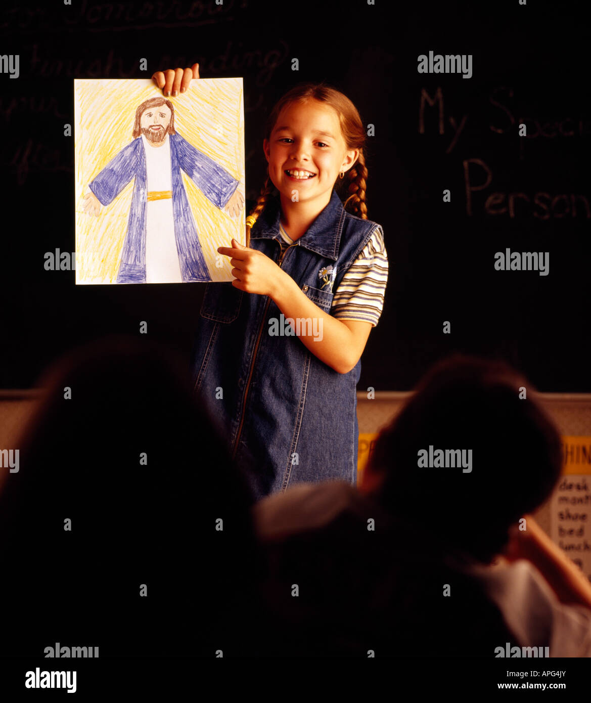 Kind mit Bild von Jesus Stockfoto