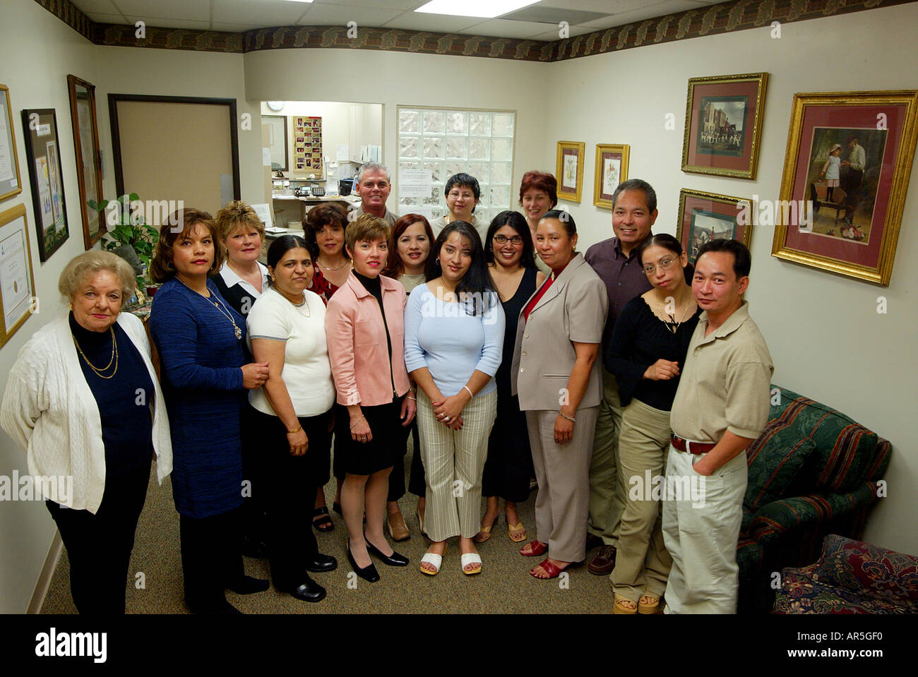 The staff of a fertility clinic poses in the waiting room of their Fountain Valley California USA. Stockfoto