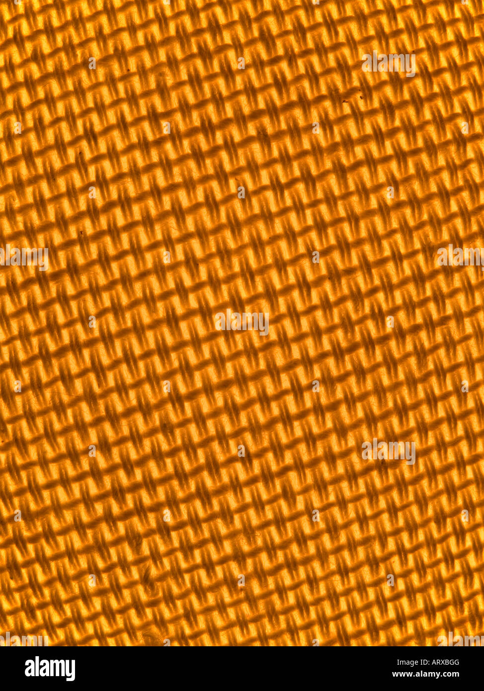 Hinterleuchtete orange Hintergrund Leinwandstruktur Stockfoto