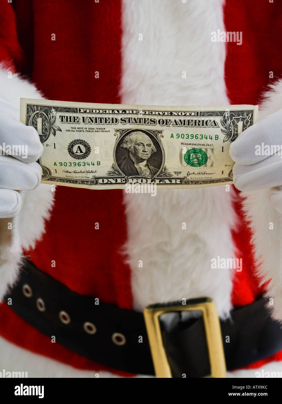 Santa halten Geld Stockfoto