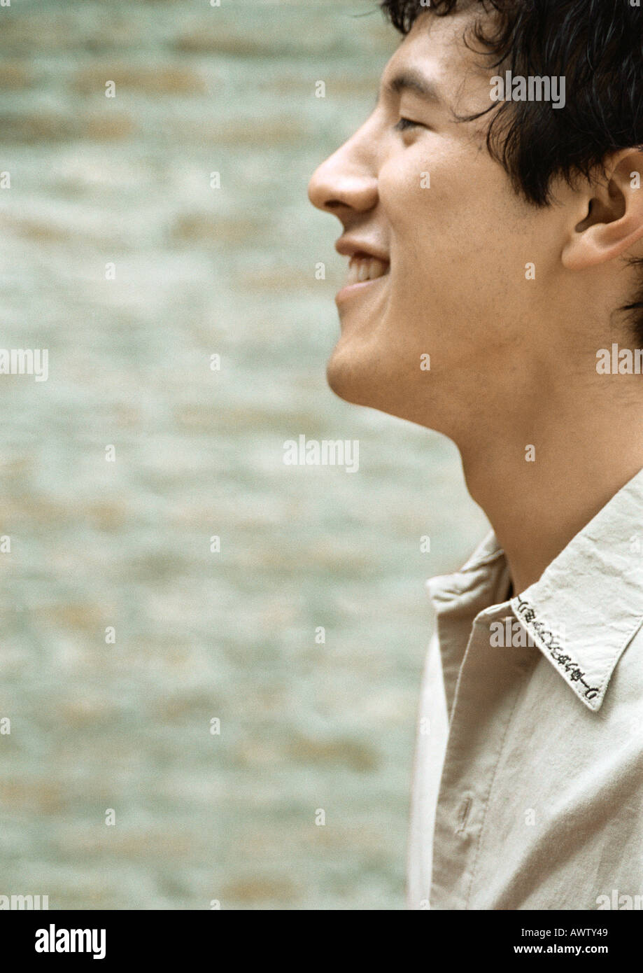 Mann lächelnd, Profil Stockfoto