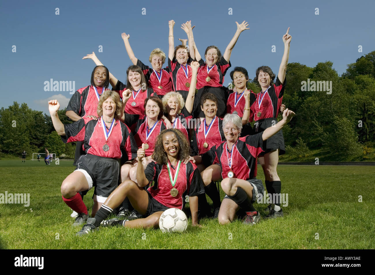 Weibliche Fußball Team feiert Stockfoto
