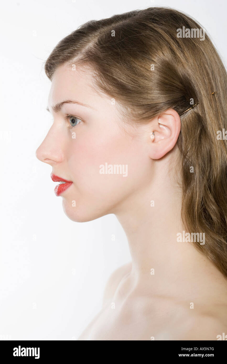 Junge Frau Profil, rote Lippen Stockfoto