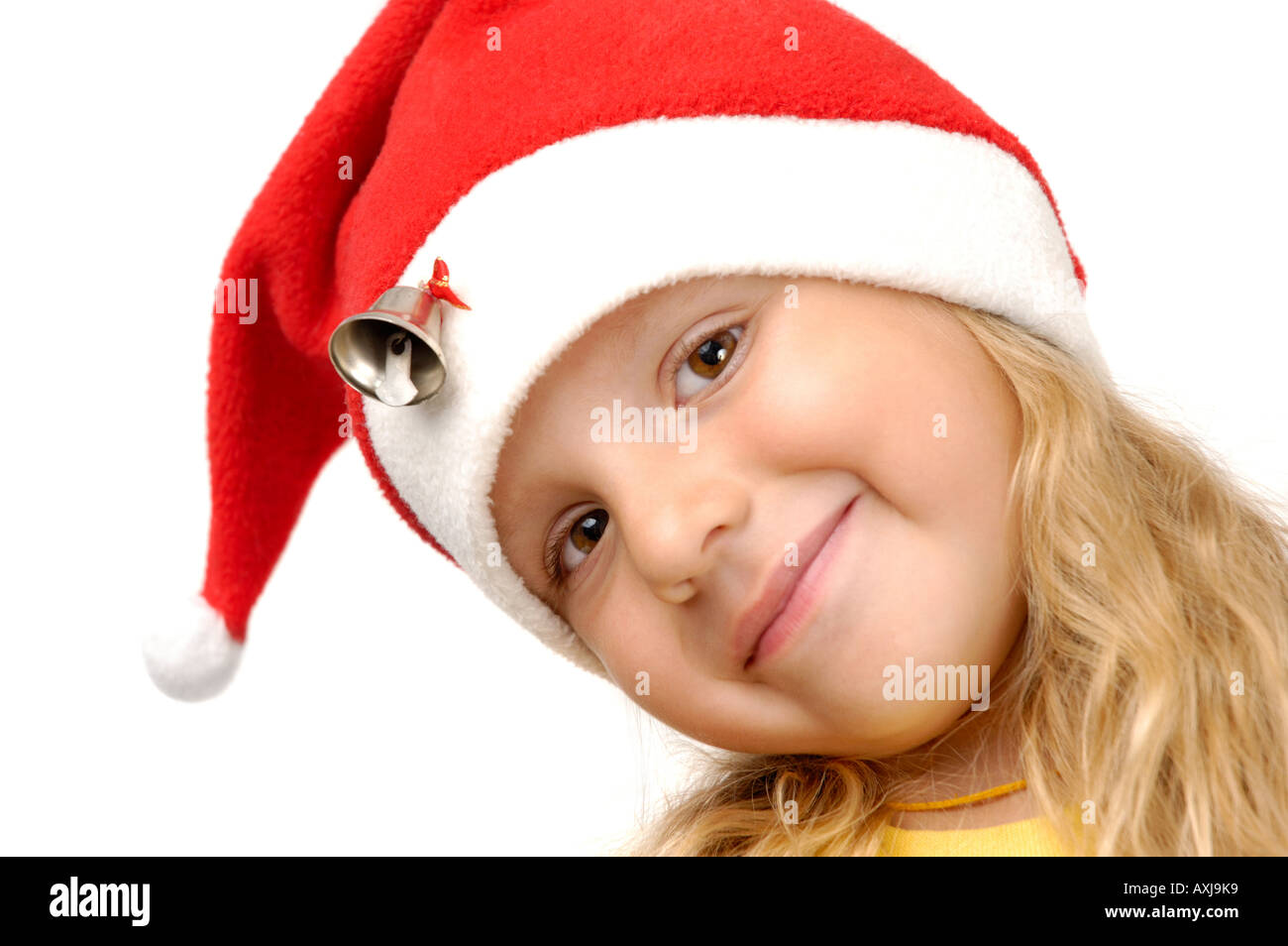 Lächelnde Mädchen in Weihnachtsmütze Stockfoto
