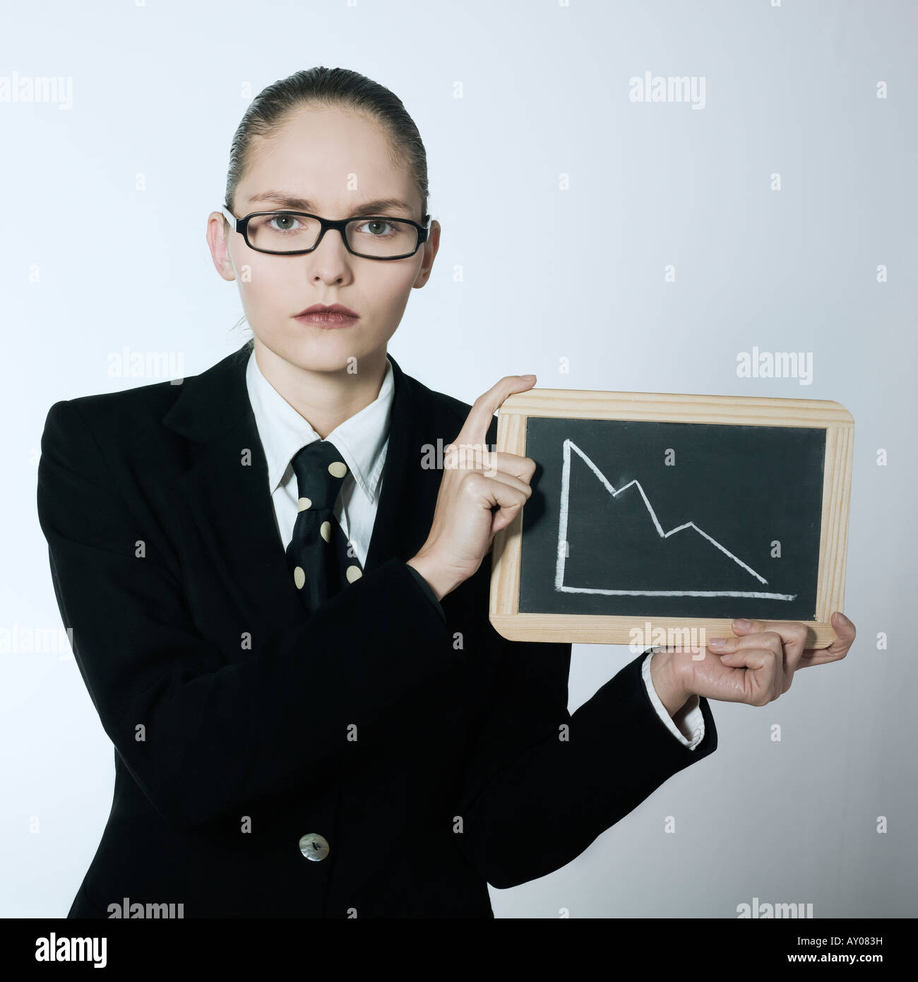 Studio, Porträt einer schönen jungen Frau in einem Kostüm Anzug erschossen Stockfoto