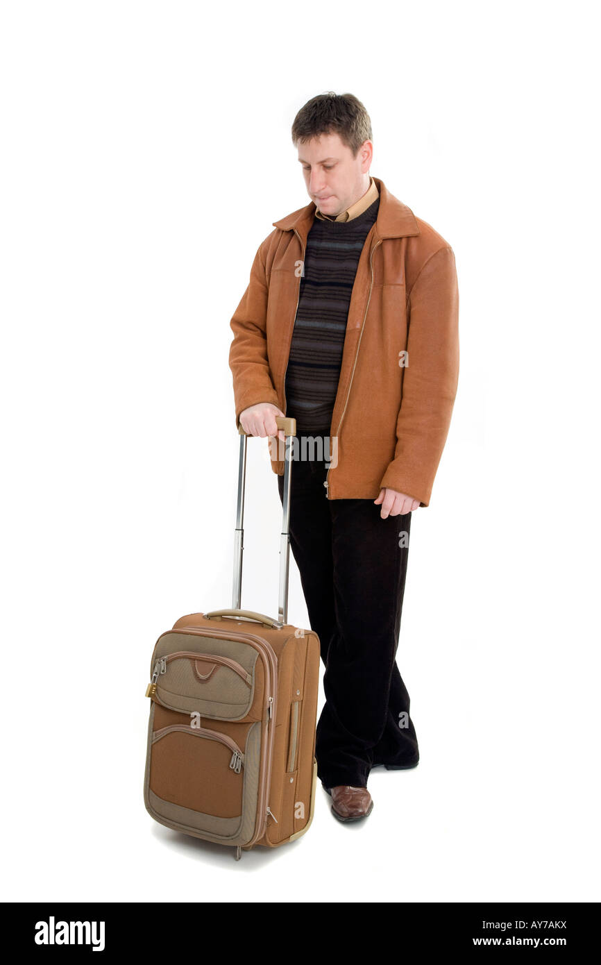 Mann in braune Jacke mit Koffer Stockfoto