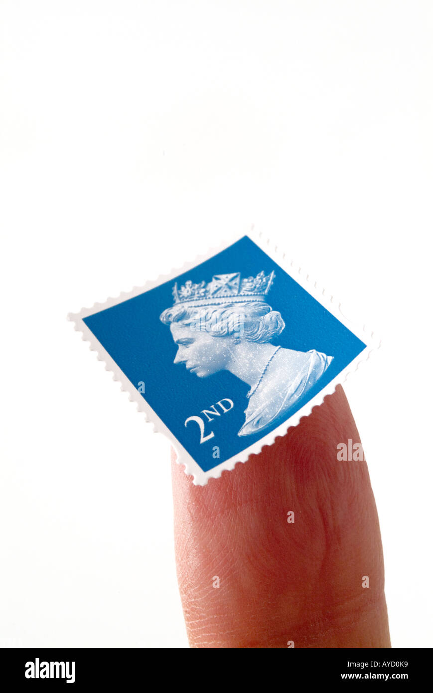 Finger mit einem zweitklassigen Stempel stecken, um es Stockfoto