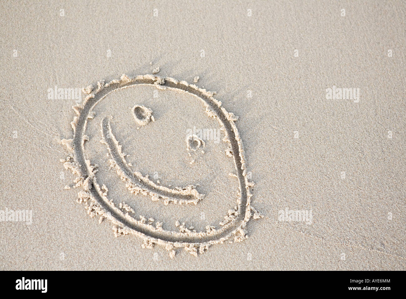 Smiley-Gesicht im sand Stockfoto