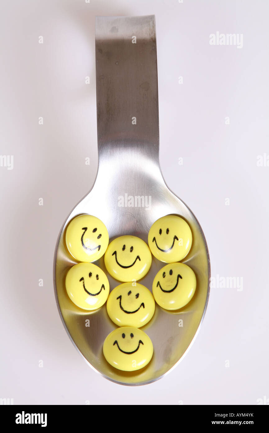 Smiley-Gesichter in silbernen Löffel Stockfoto