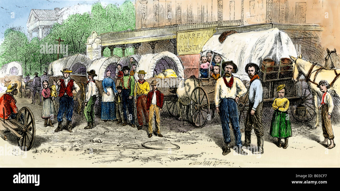 Wagen Zug der Siedler verlassen für Texas 1870. Hand - farbige Holzschnitt Stockfoto