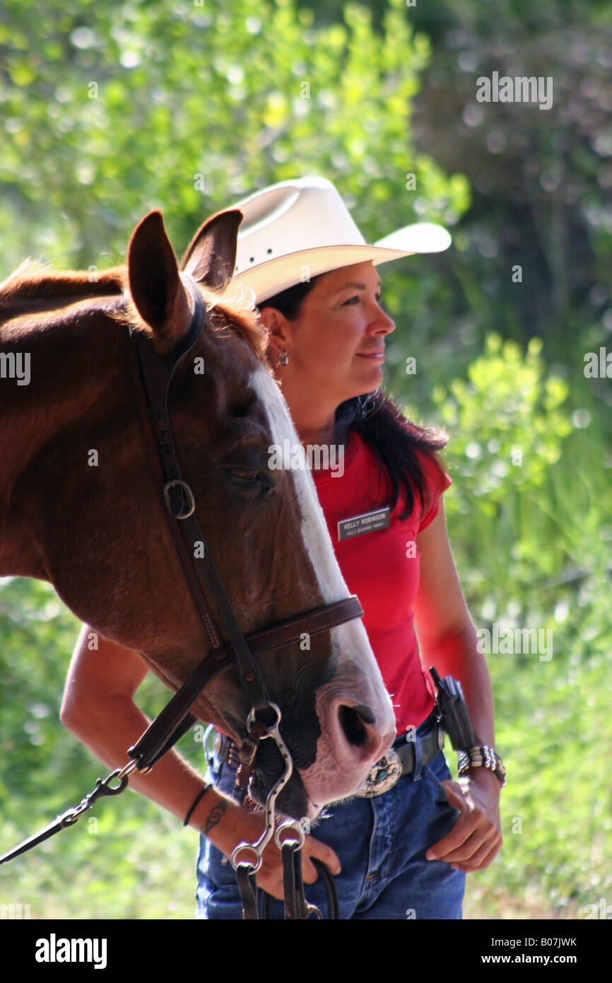 Cowgirl mit Pferd Stockfoto