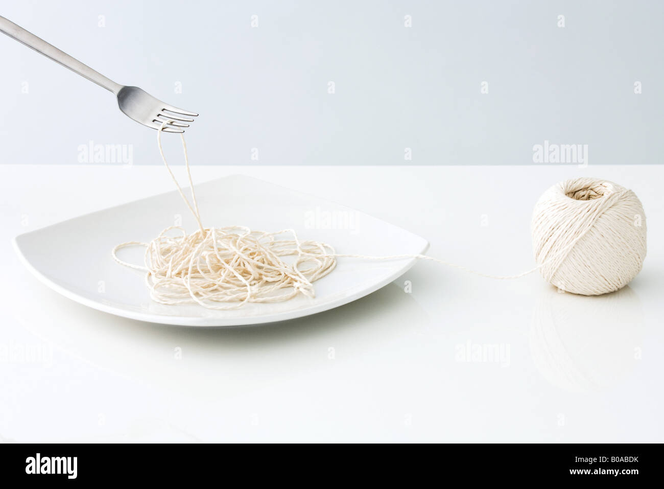 String auf Teller Spaghetti ähneln Stockfoto