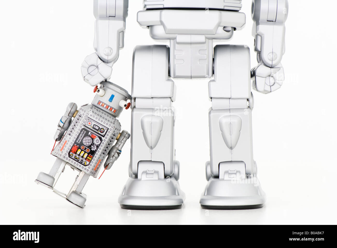 Kleine Roboter gelehnt größer Roboter Stockfoto