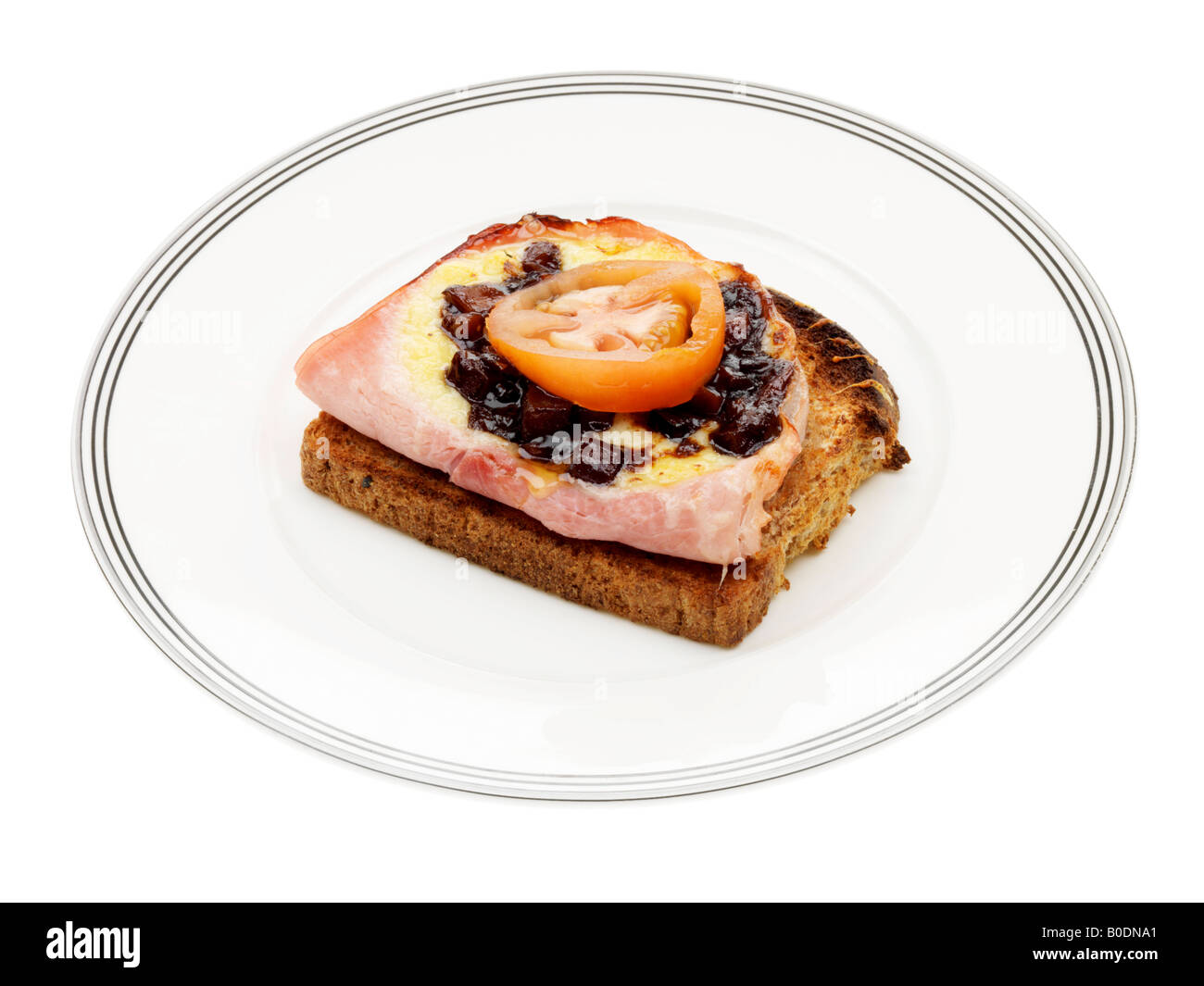 Käse, Schinken und Gurke auf Toast Stockfoto