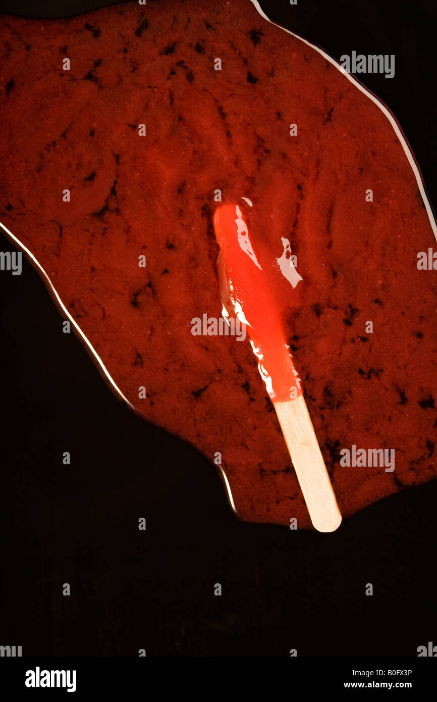 Gefrorenen Eis am Stiel schmelzen Stockfoto