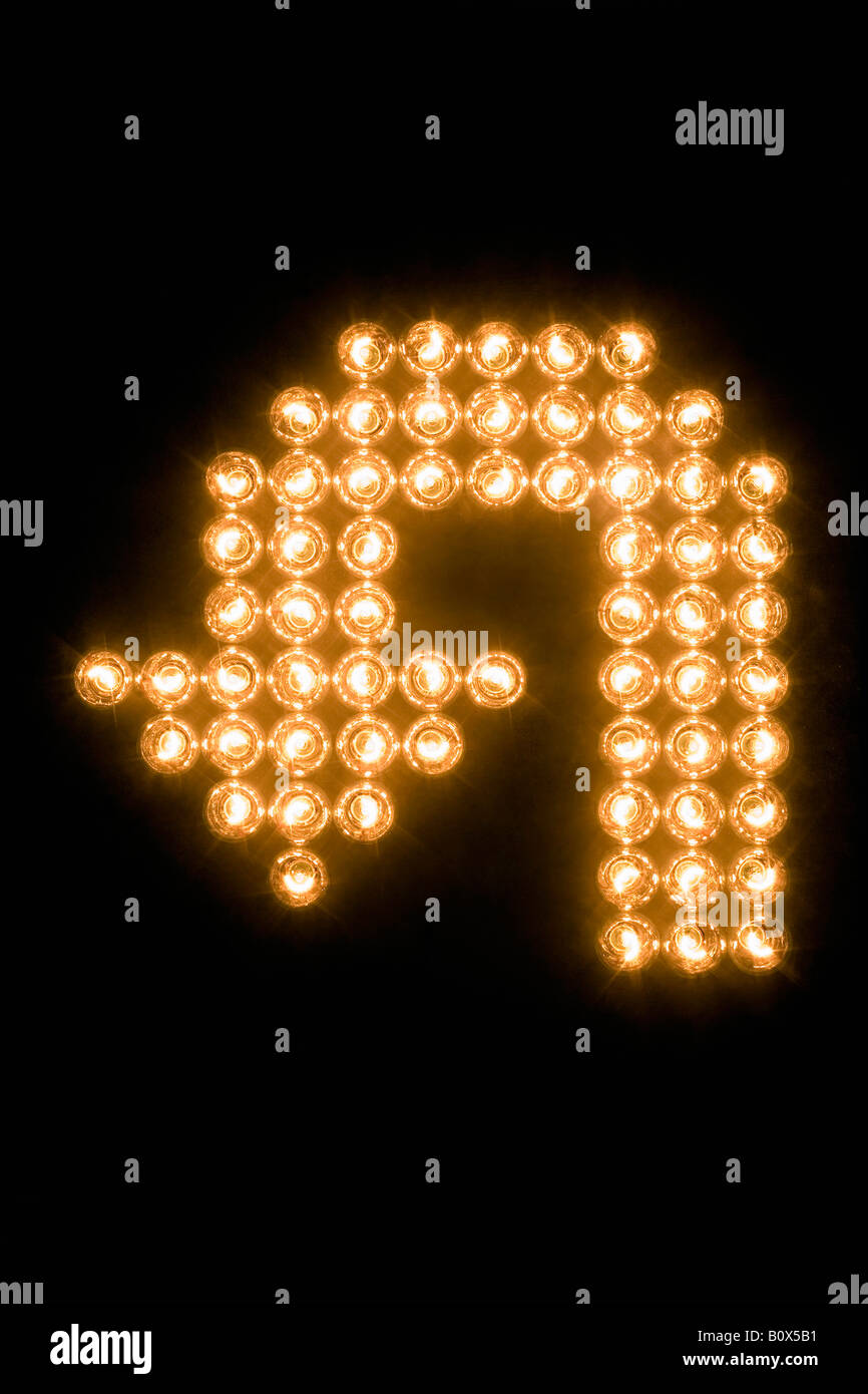 U-turn Symbol gemacht mit beleuchteten Glühbirnen Stockfoto