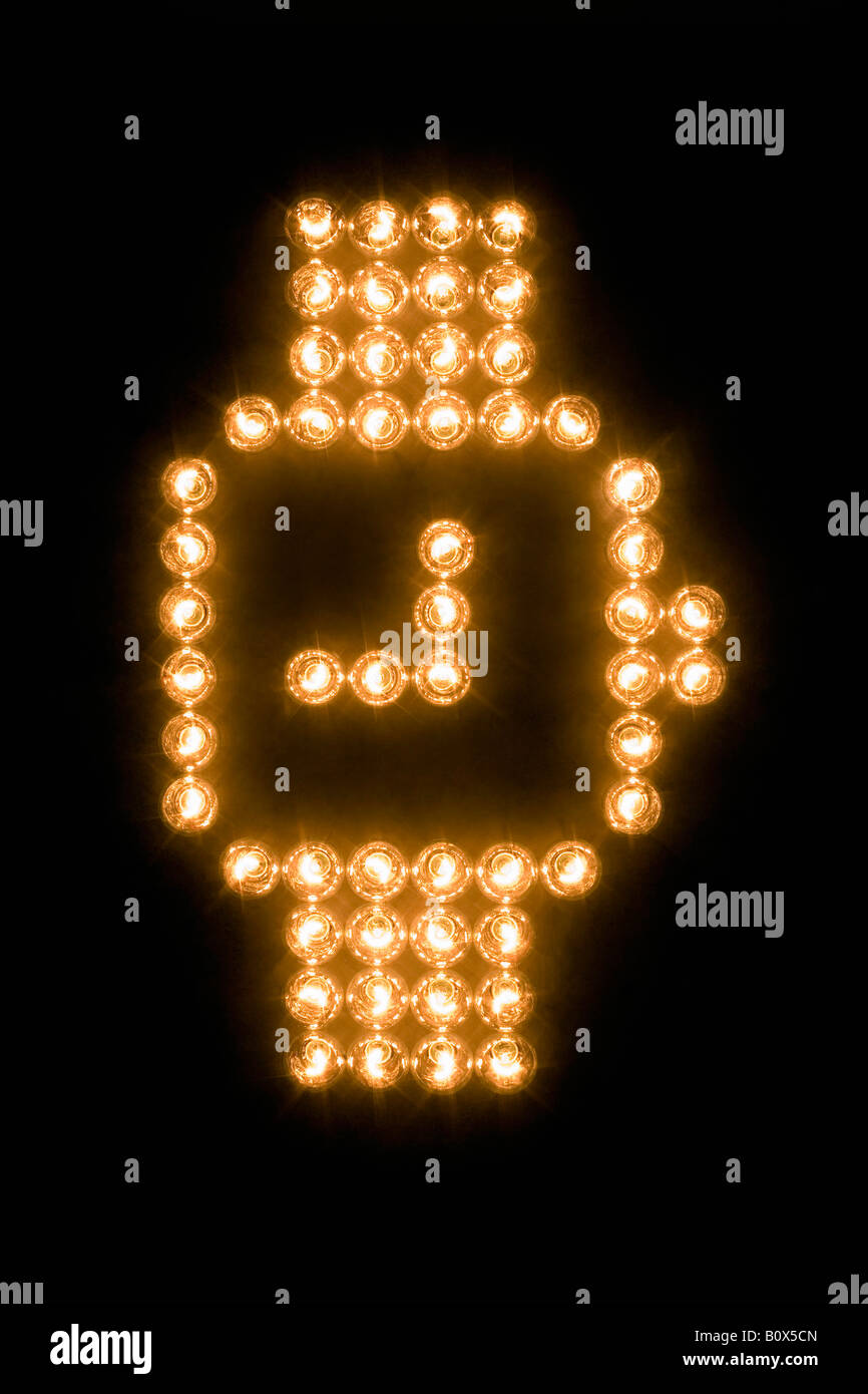 Armbanduhr-Symbol gemacht mit beleuchteten Glühbirnen Stockfoto