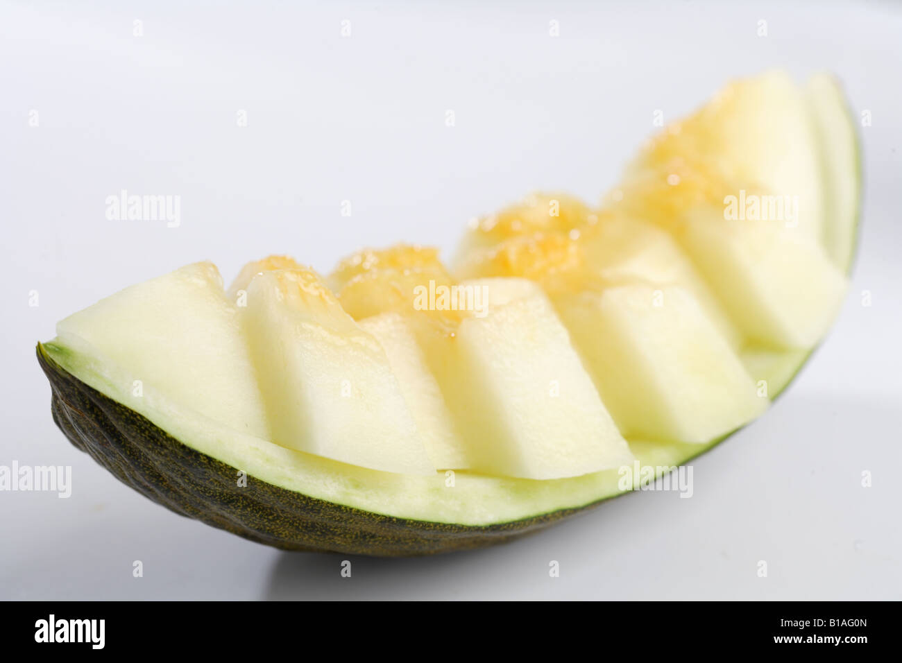 Eine Scheibe Melone in Stücke geschnitten Stockfoto