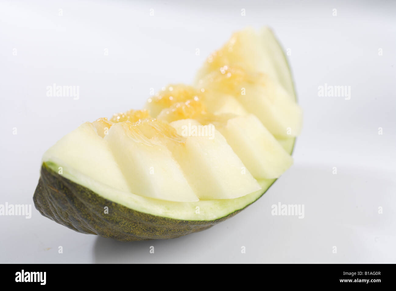 Eine Scheibe Melone in Stücke geschnitten Stockfoto