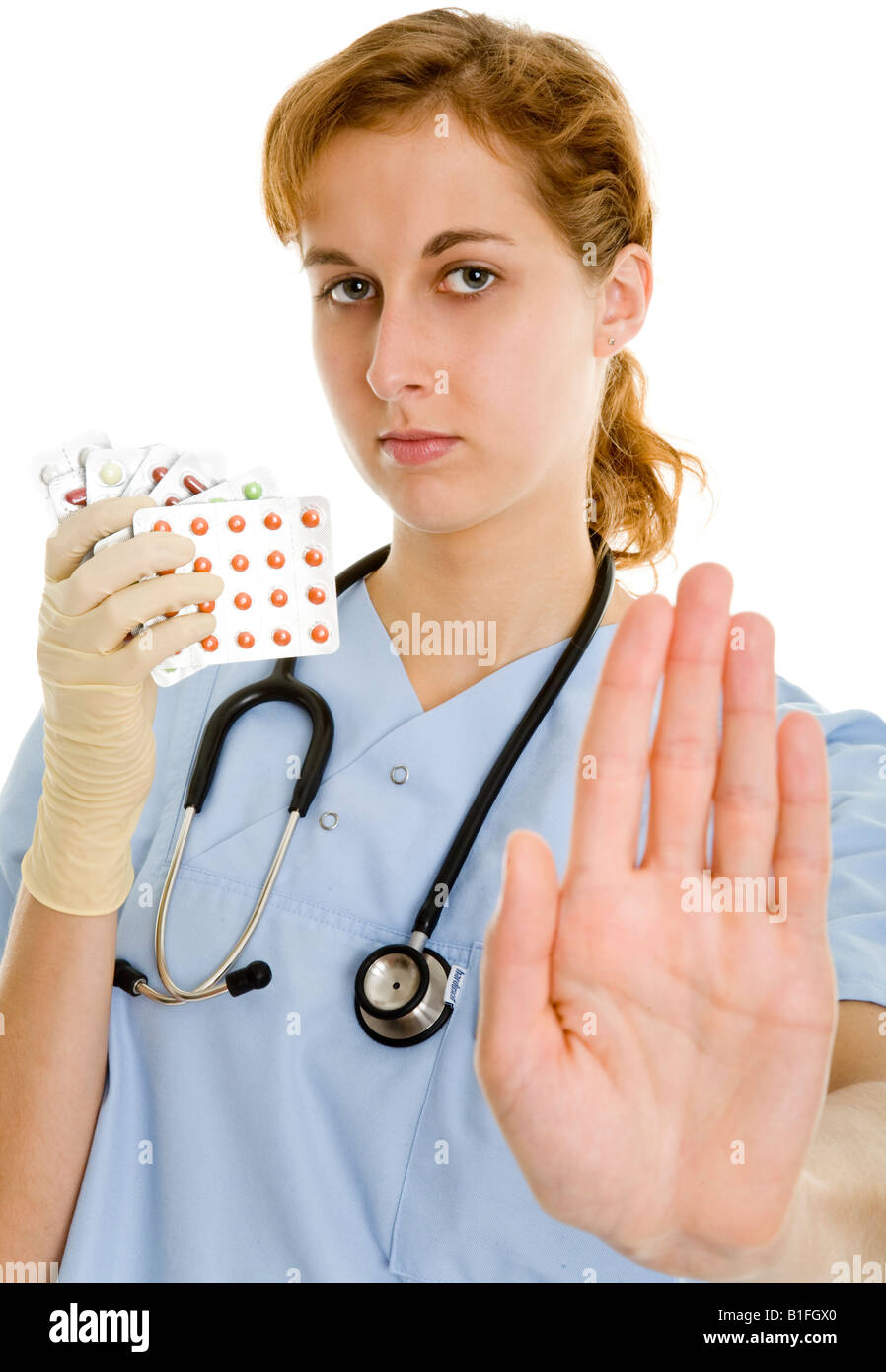 Krankenschwester mit Tabletten und Warnzeichen Stockfoto