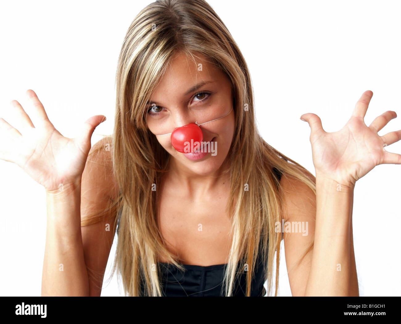 Close-up Portrait einer jungen Frau mit Clownsnase Stockfoto