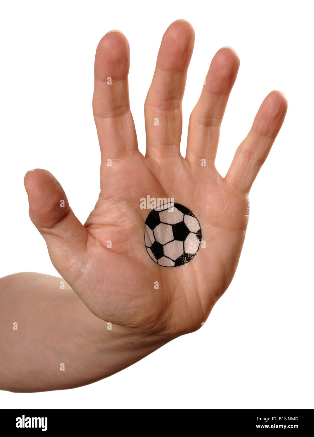 Mans Hand mit Fußball auf palm Stockfoto