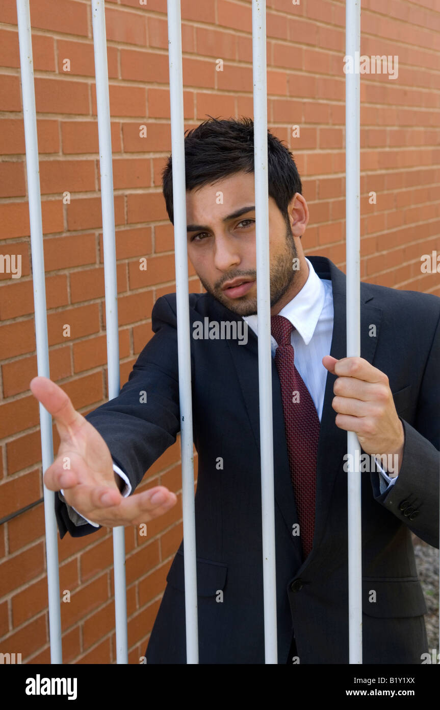 Business-Mann hinter Gittern Stockfoto