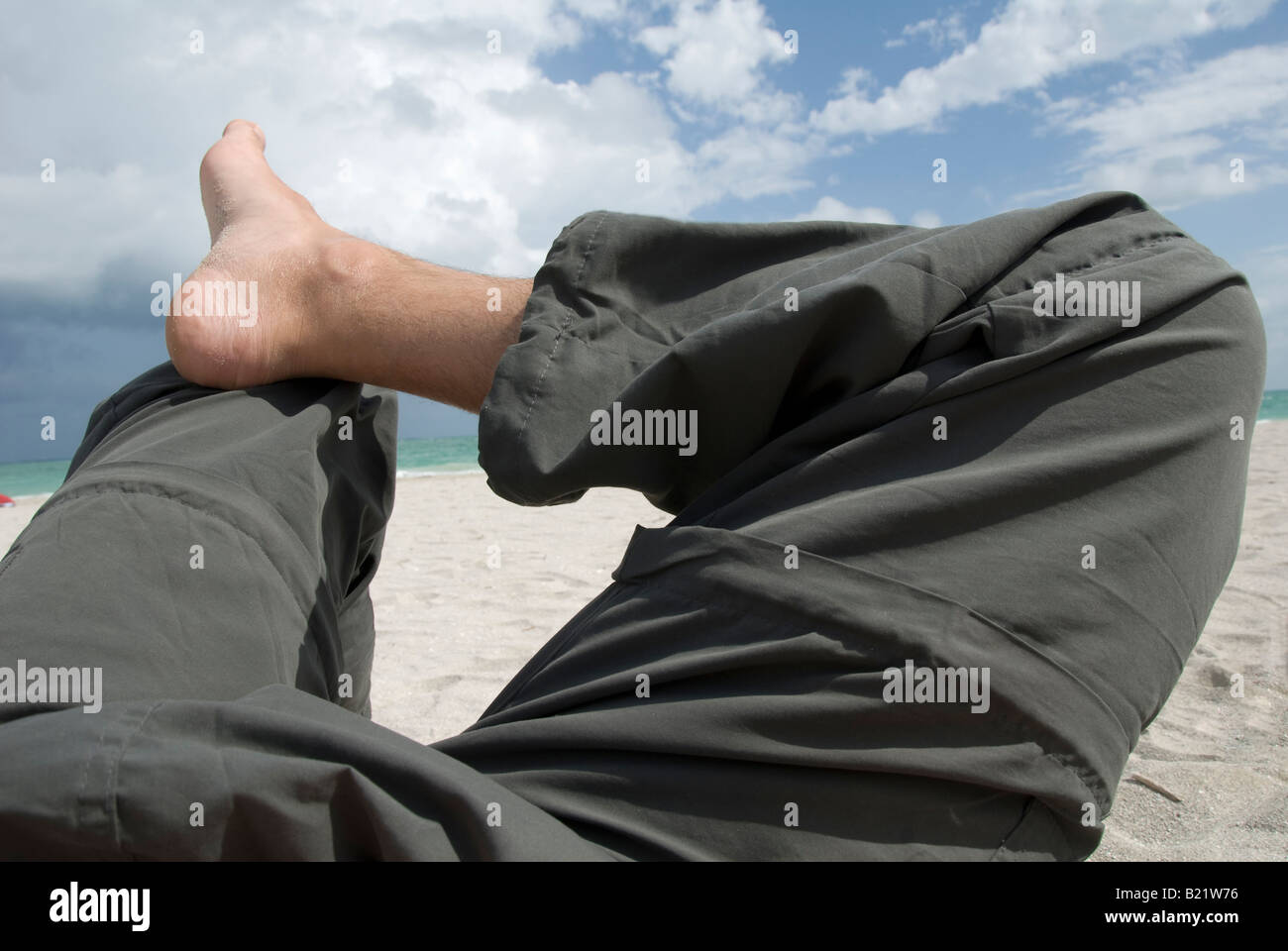 Beine am Strand Stockfoto
