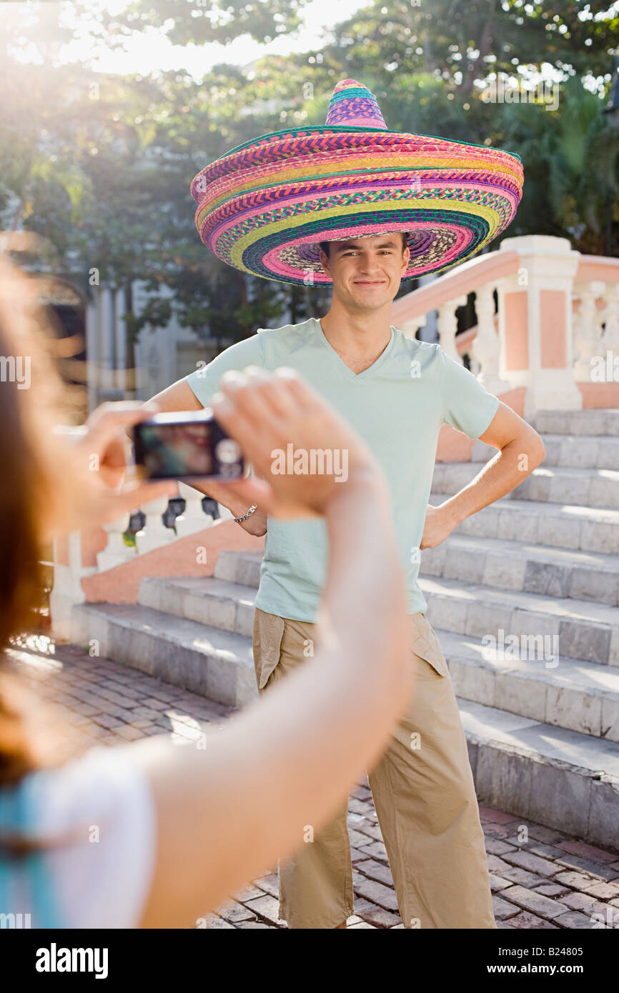 Frau fotografieren Mann tragen sombreros Stockfoto