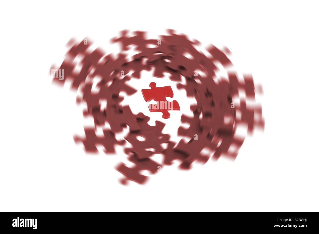 Isolierte Stück rote Puzzles umgeben von wirbelnden Masse Stockfoto