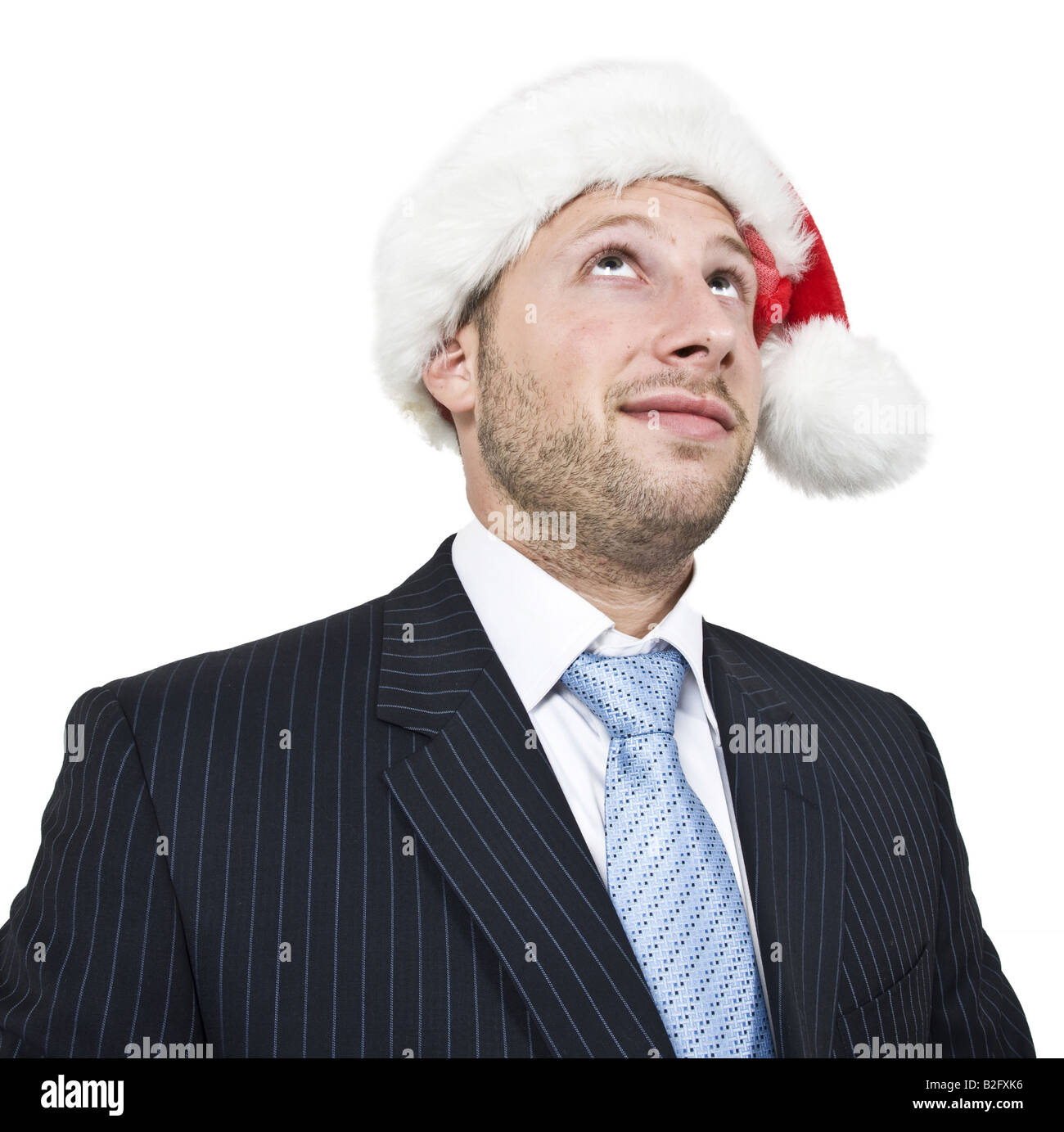Geschäftsmann, Blick auf den Kopf, während eine Weihnachts-Mütze trägt und trägt einen Anzug und Krawatte. großen Konzeptbild für Werbung Stockfoto