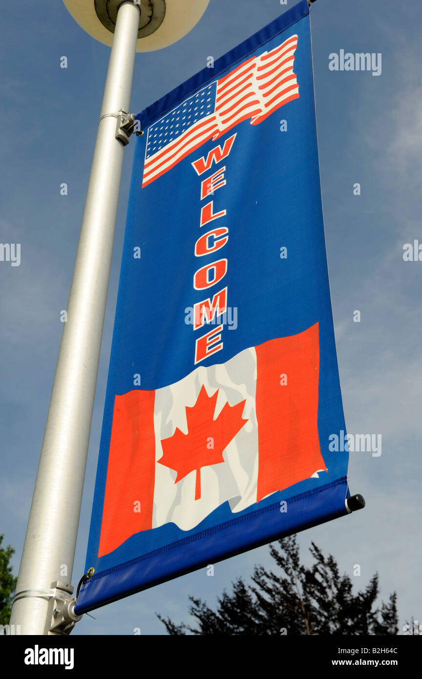 Willkommen Schild mit kanadischen und amerikanischen Flagge Stockfoto