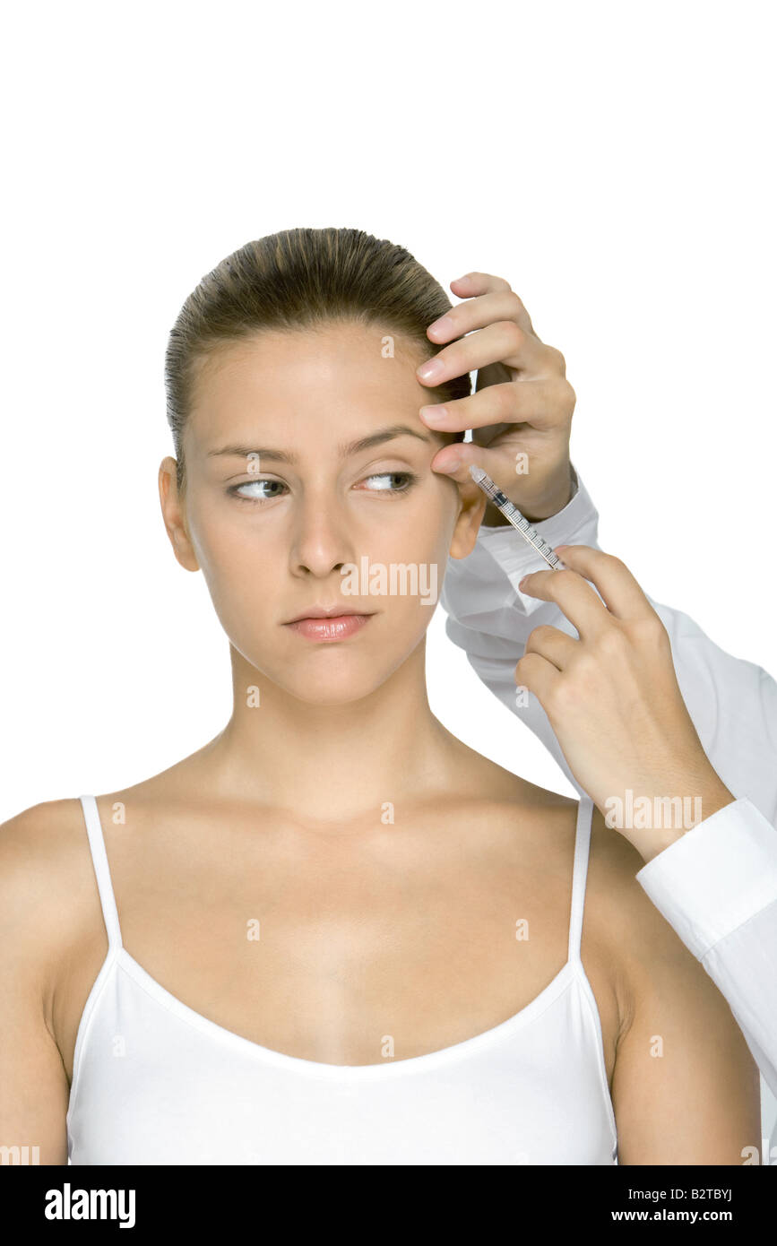 Junge Frau empfangen Botox-Injektion Stockfoto