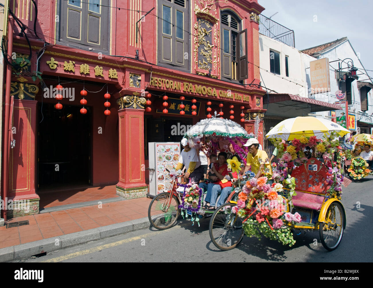 Touristischen Rikschas spielt bekannte Huhn Reisball Famosa Restaurant Malacca Malysia Stockfoto