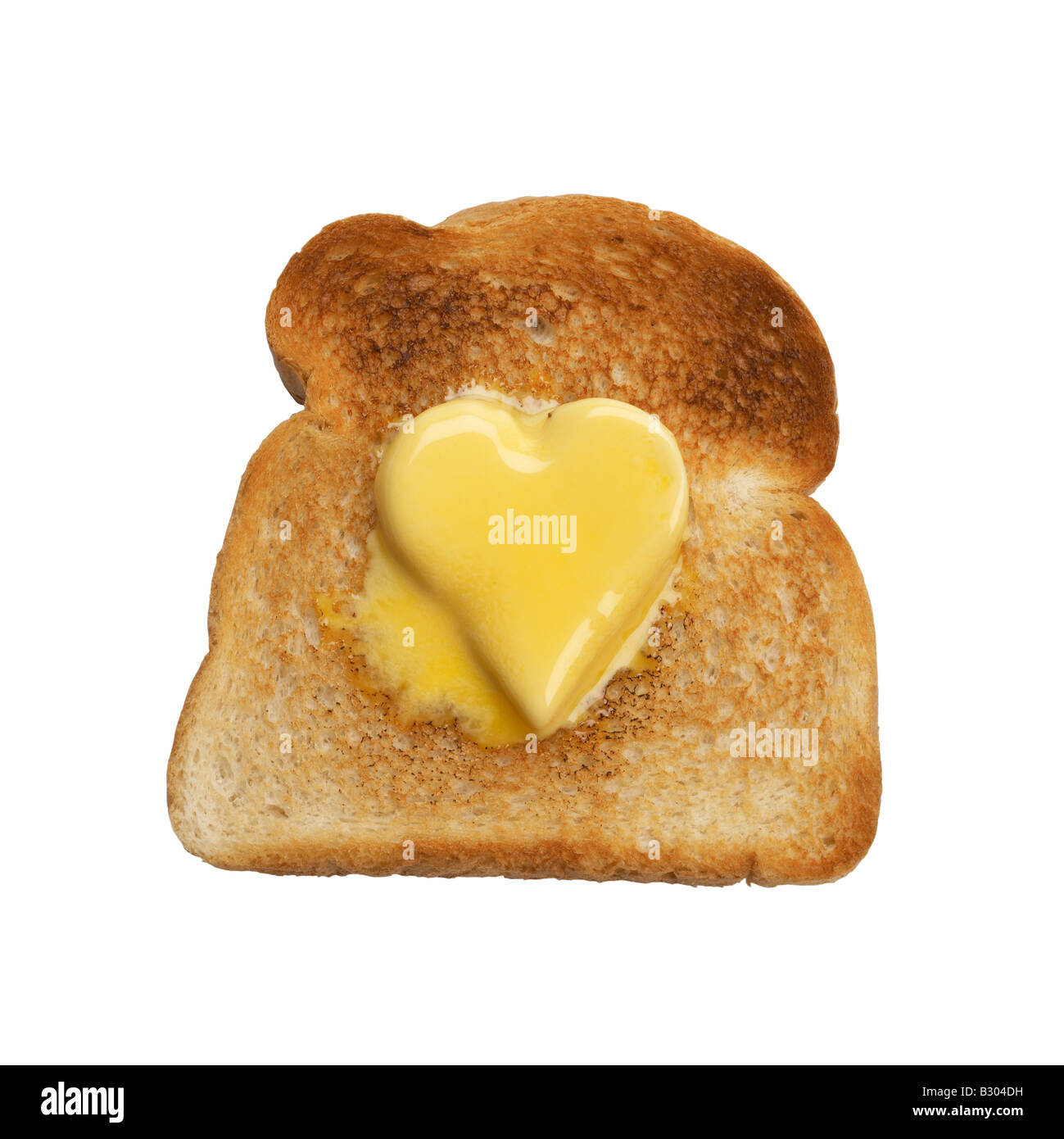 Scheibe Toast mit herzförmigen Stückchen butter Stockfoto