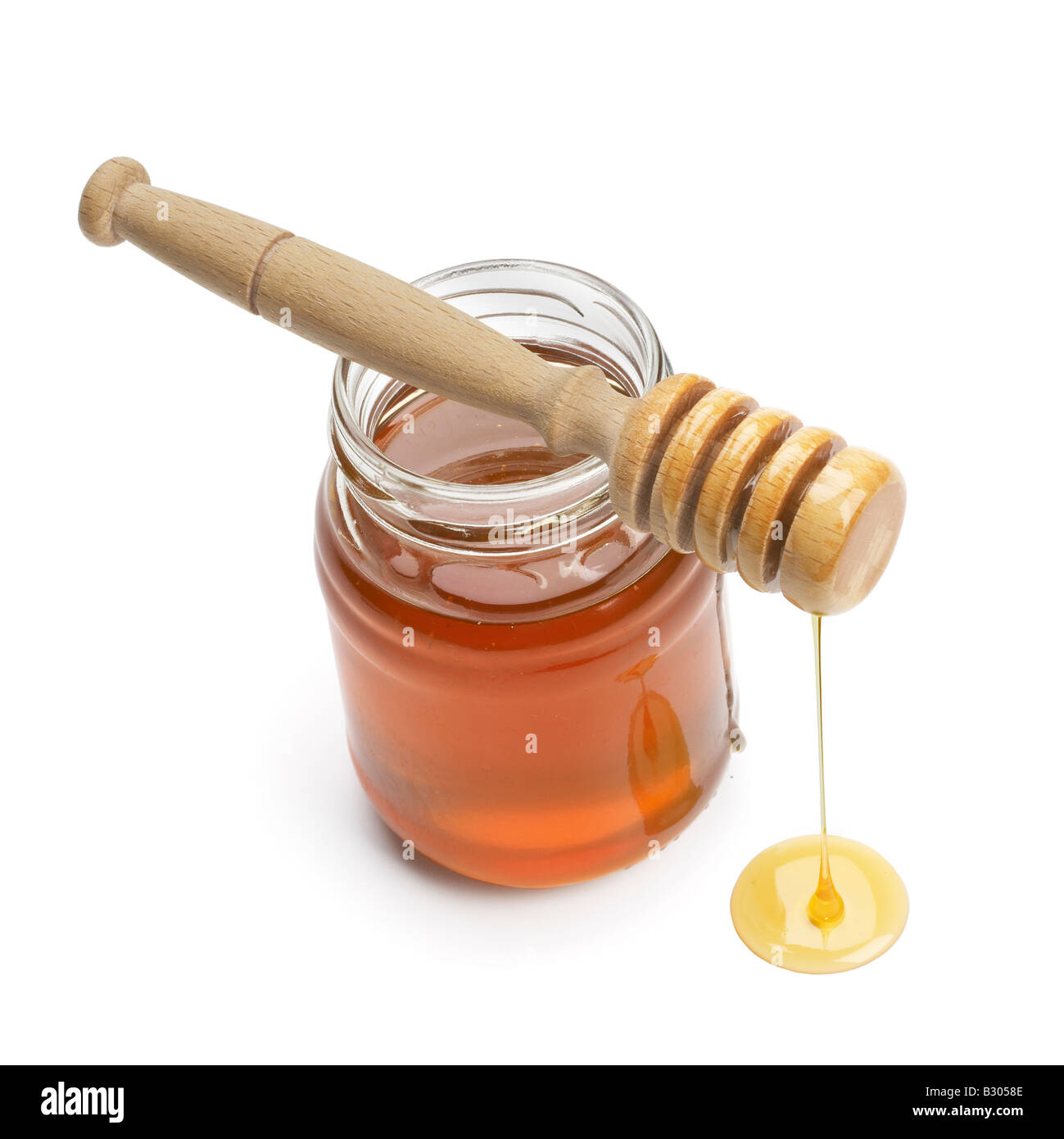 Glas Honig mit drizzler Stockfoto