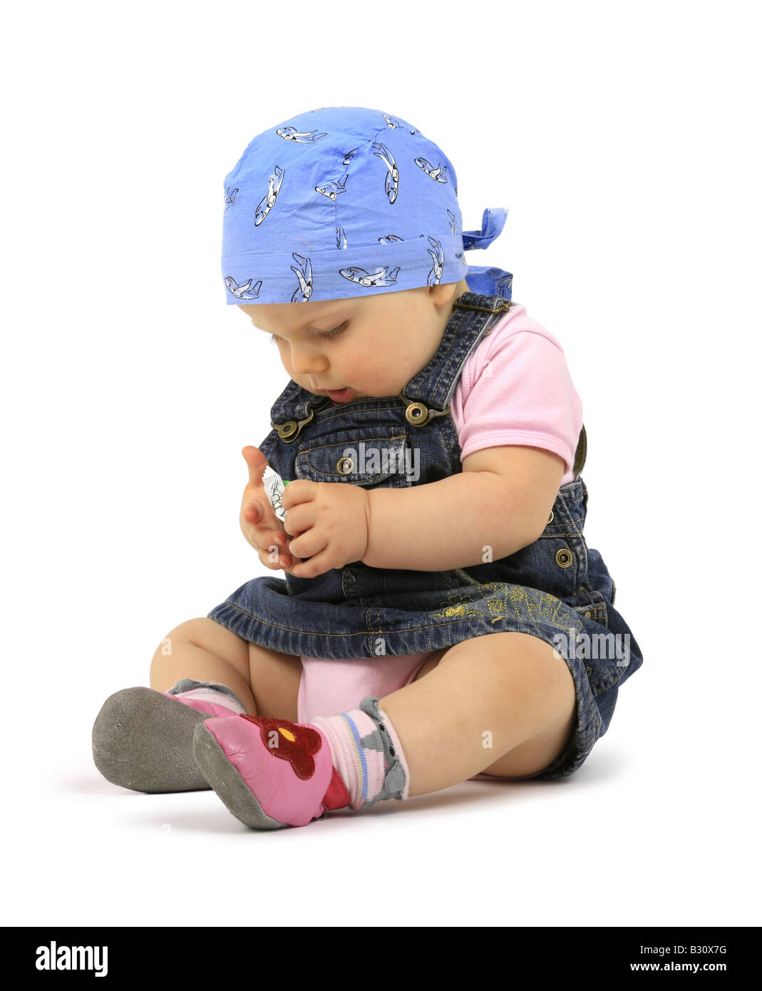 Baby mit Süßigkeiten Stockfoto