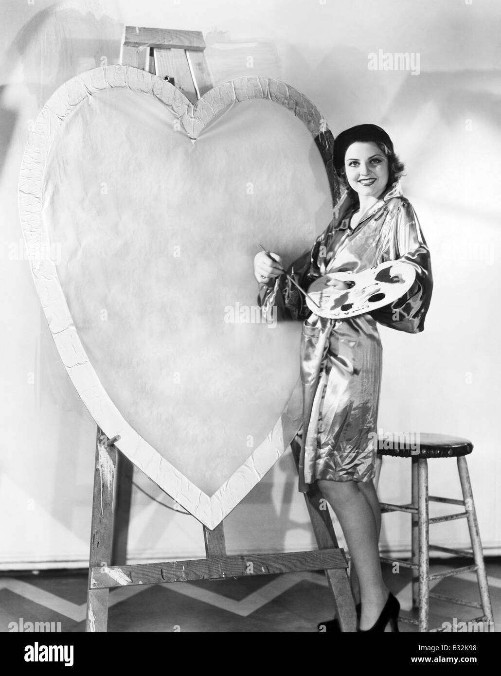 Frau Malerei riesige valentine Stockfoto