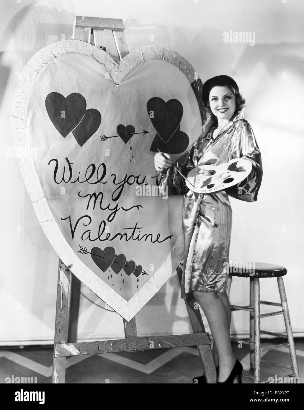Frau Malerei riesige valentine Stockfoto