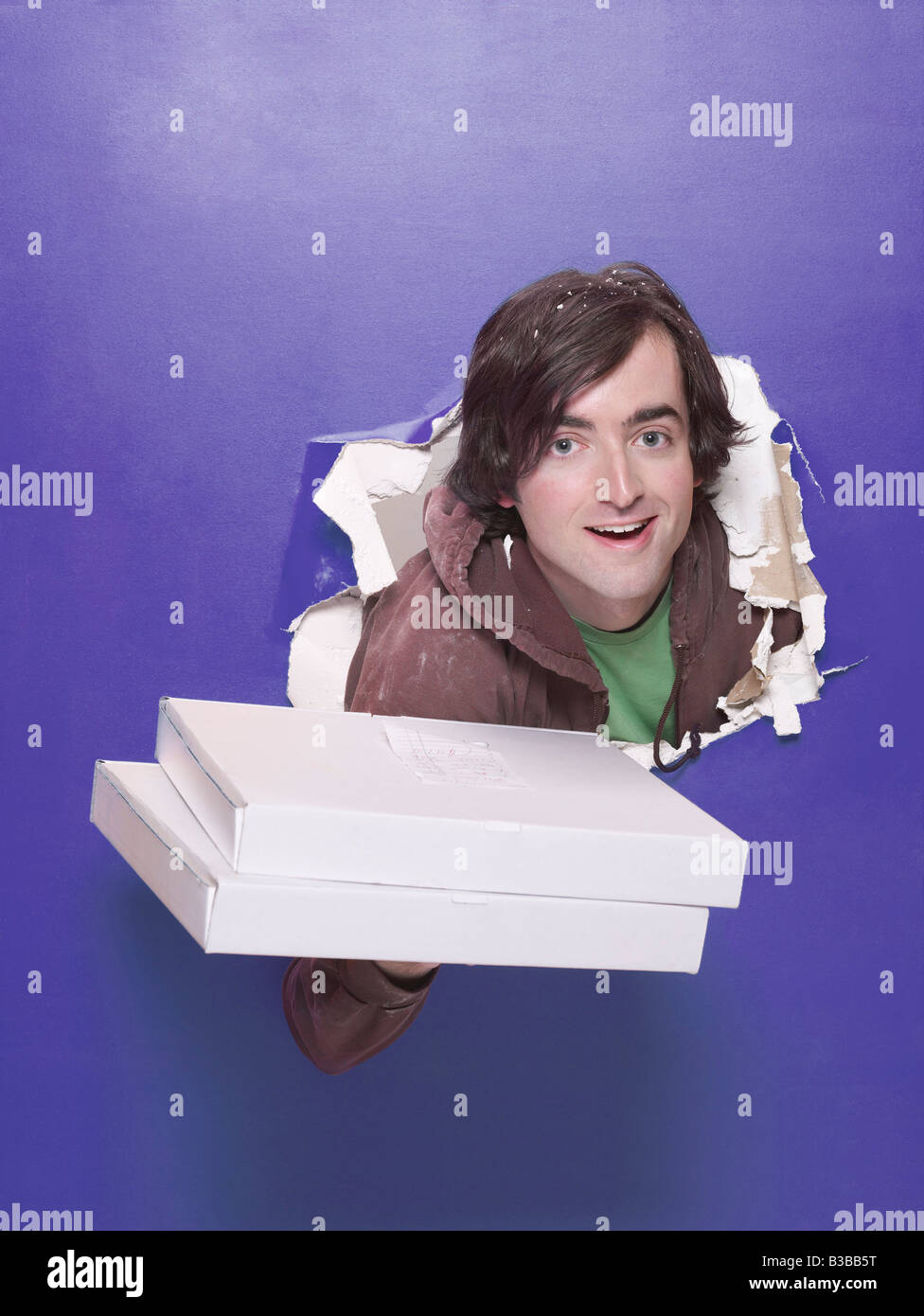 Pizzamann Wand durchbrechen Stockfoto