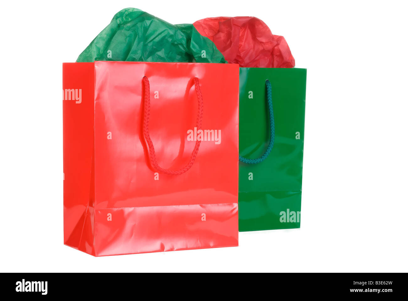 Rote und grüne Einkaufstaschen auf weiß Stockfoto