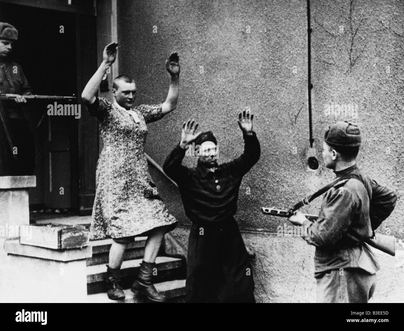 Deutsche Soldaten in Zivil/POW Stockfoto