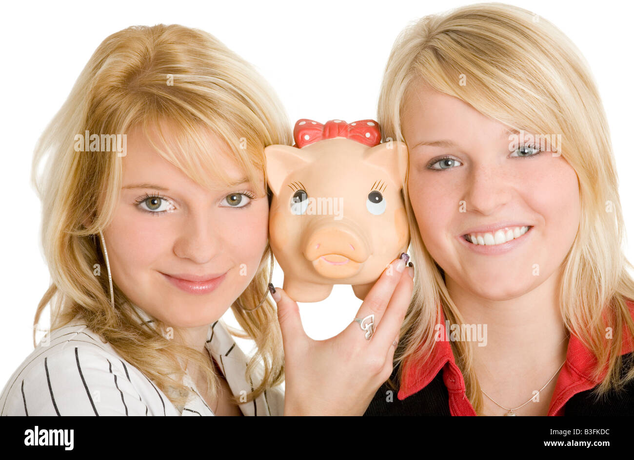 blonde Mädchen mit Sparschwein Stockfoto