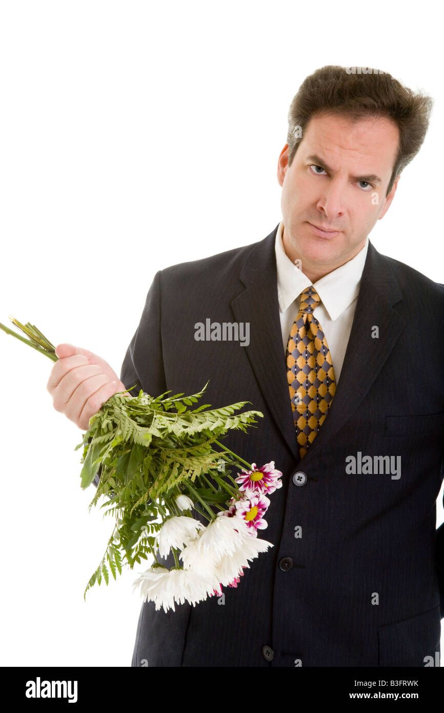 trauriger Mann mit Blumen Stockfoto