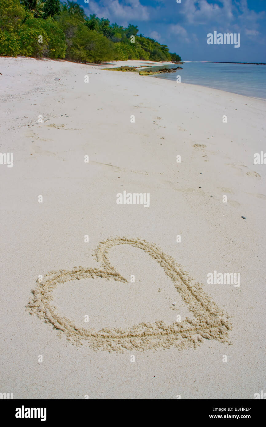 Herz im sand Stockfoto